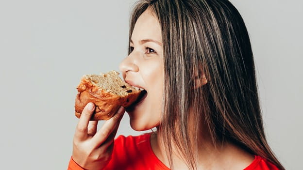 Better for You Baking - Woman Eating Bread